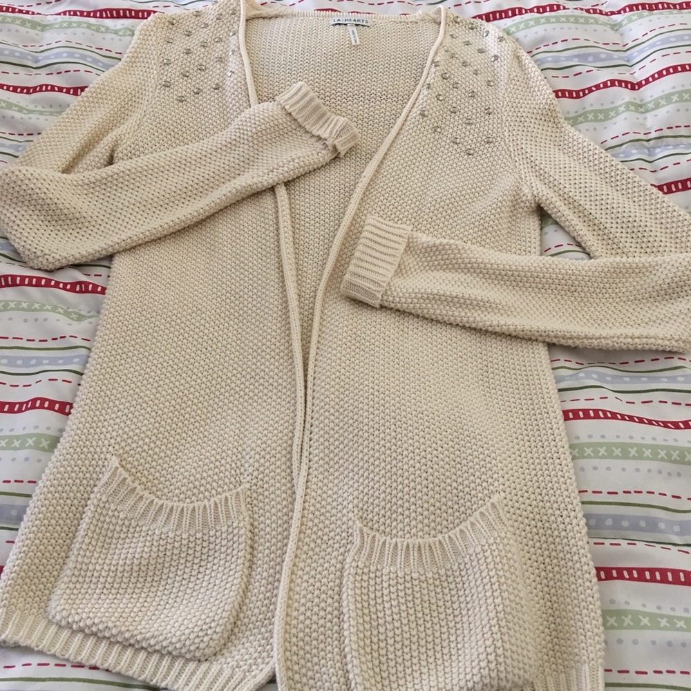 Cream color silver studded sweater.